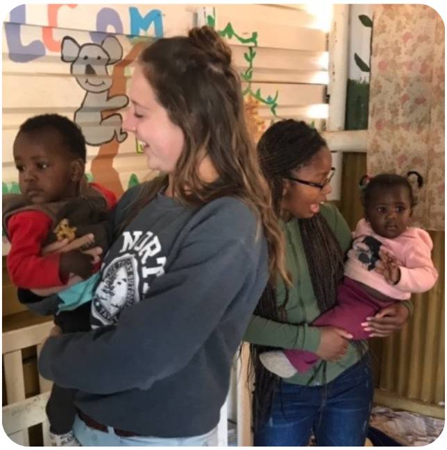 Students with local children during a study abroad trip to Namibia